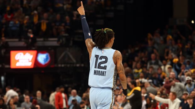 Memphis Grizzlies guard Ja Morant celebrates after a play.